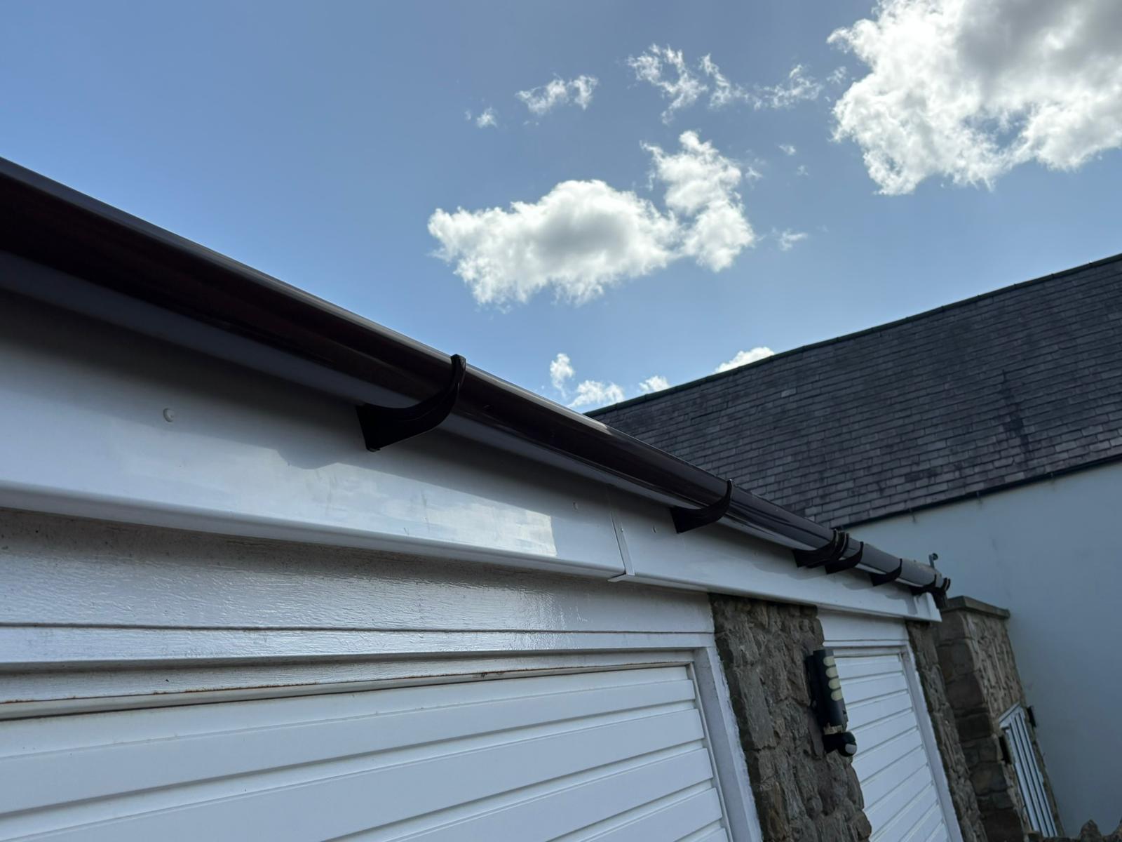 White uPVC fascia board installation on roof edge of Durham property