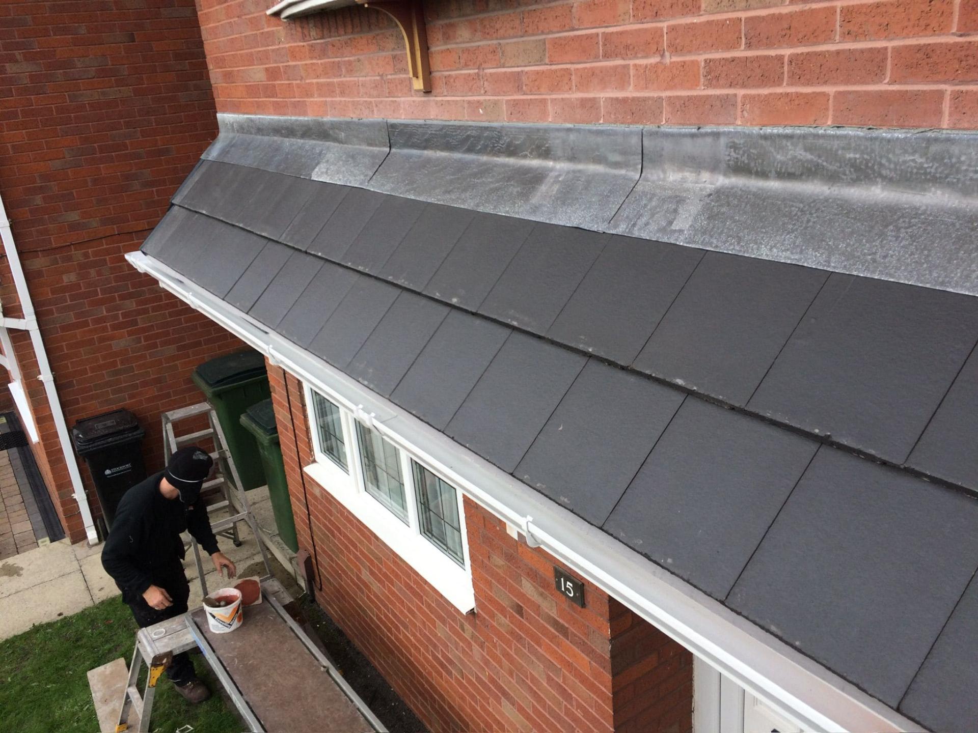 New uPVC gutter and downpipe installation on residential property roofline