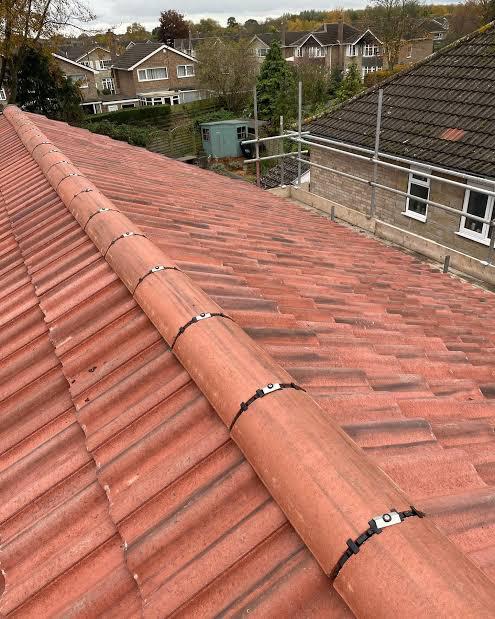 Ridge tiles with mechanical fixings on pitched roof