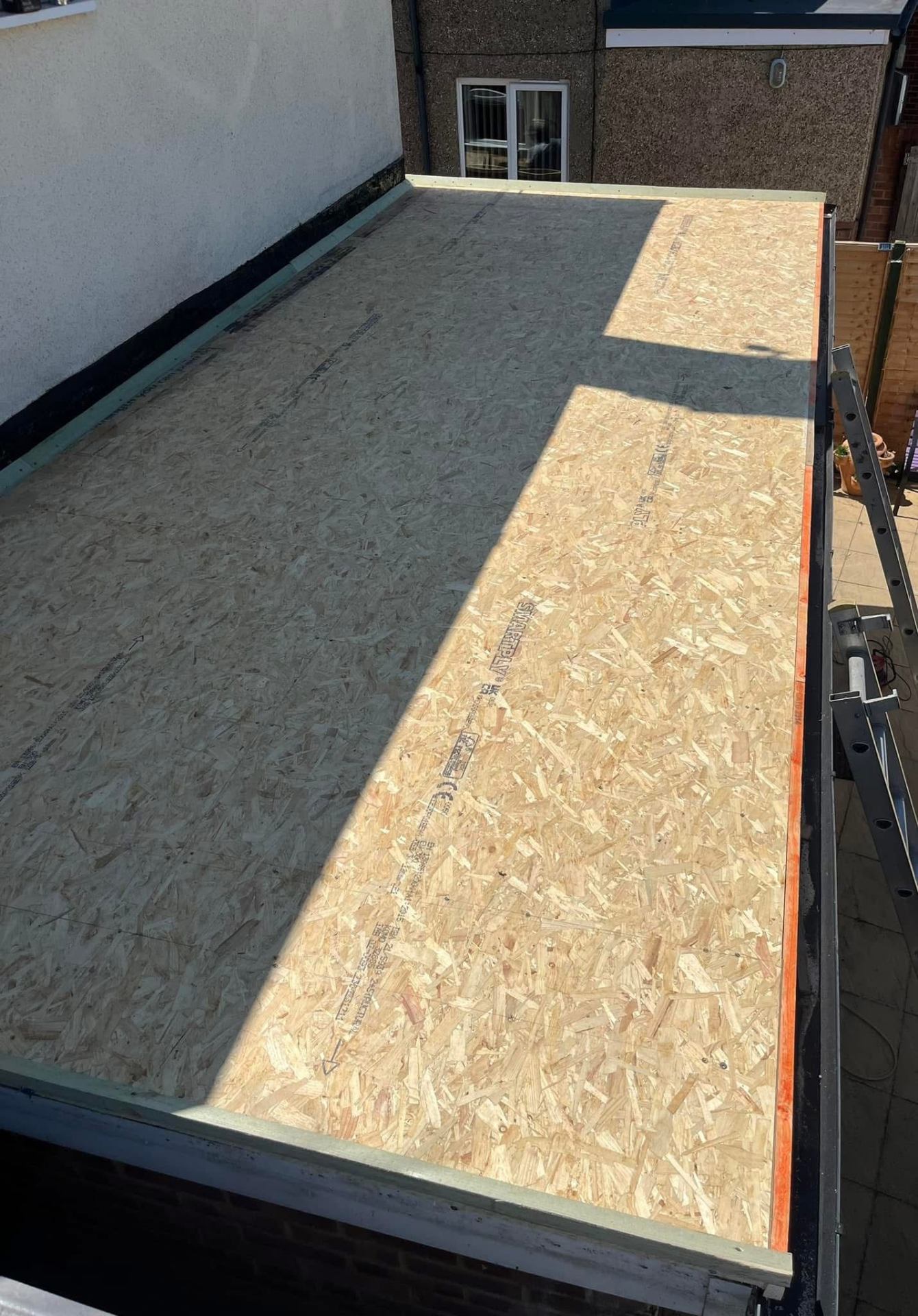Flat roof insulation boards laid before membrane installation
