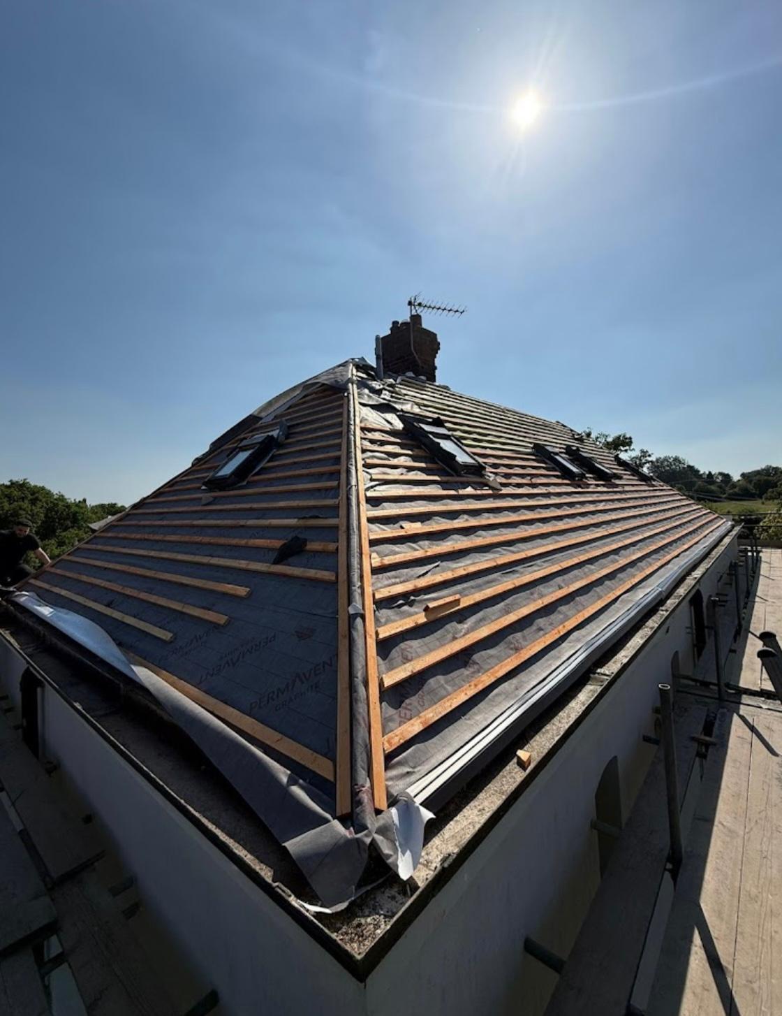 Roof framework with breathable membrane and battens during re-roof